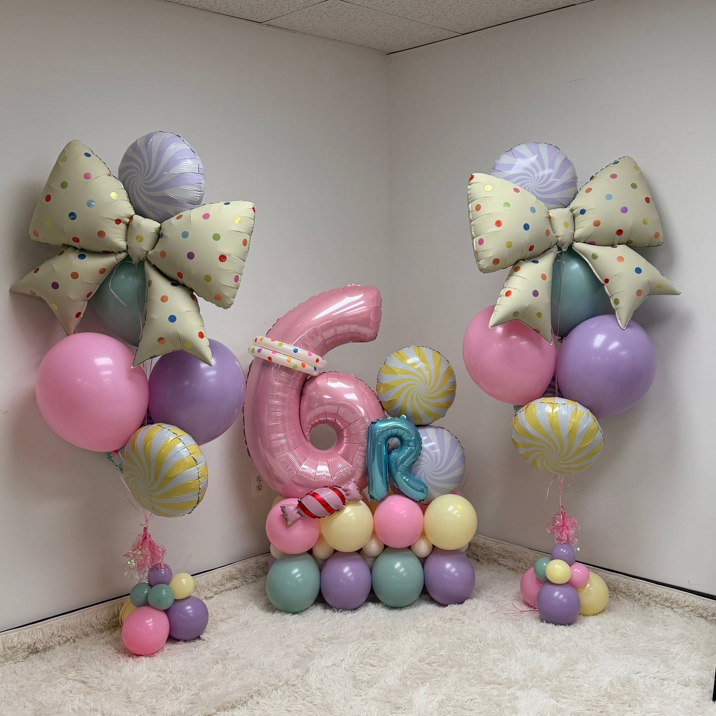 Balloon decorations with numbers and letters in a room setting
